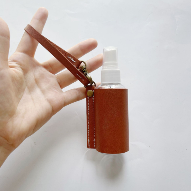 LLavero de Gel hidroalcohólico, funda desinfectante de manos, minibotella de Gel hidroalcohólico portátil, Funda de cuero, llavero de salud, 1 ud.: brown