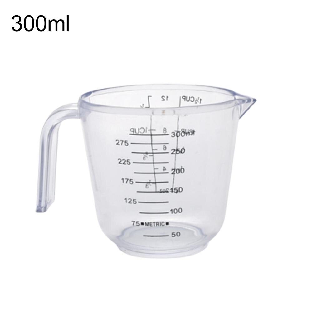 150/300/600ml håndtak vannmelk eggskala målekopp krus måleinstrument med nyttige måleenheter og fint håndtak: Gjennomsiktig 300ml