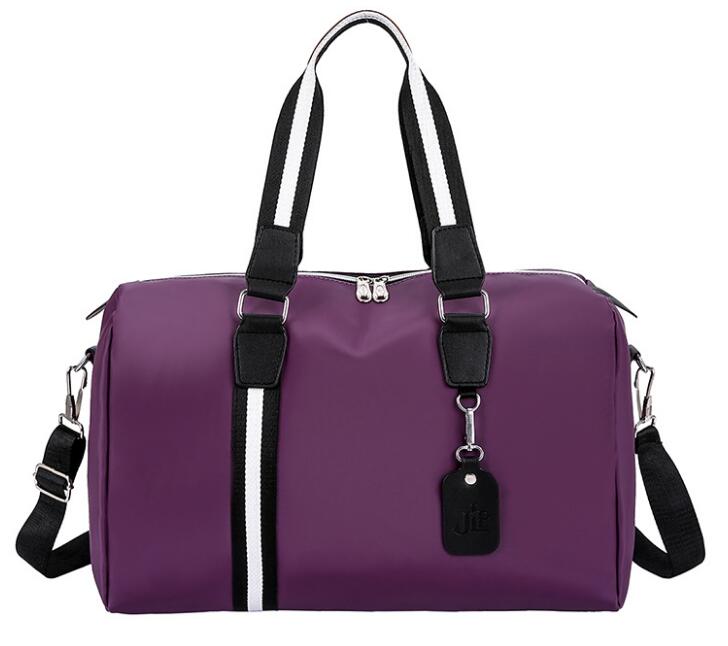 Large-capacity travel bag men and women shoulder portable nylon travel short-distance business bag: Purple 