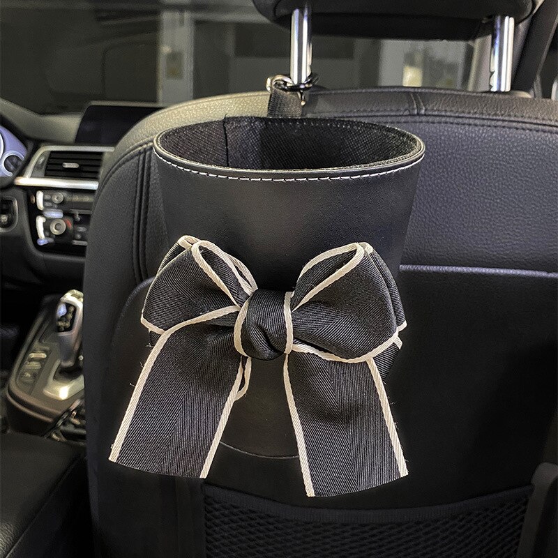 Sac poubelle à nœud papillon pour voiture, mignon, pour siège arrière, appui-tête, Mini sortie automatique, organiseur de ventilation, sac poubelle, boîte de rangement, seau