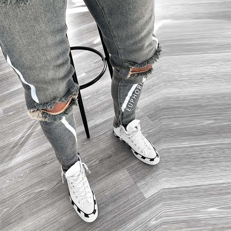jeans strappati sexy scava fuori uomo moda lettera stampa ginocchio foro nappa jeans attillati strappati Homme pantaloni da jogging casuale in denim
