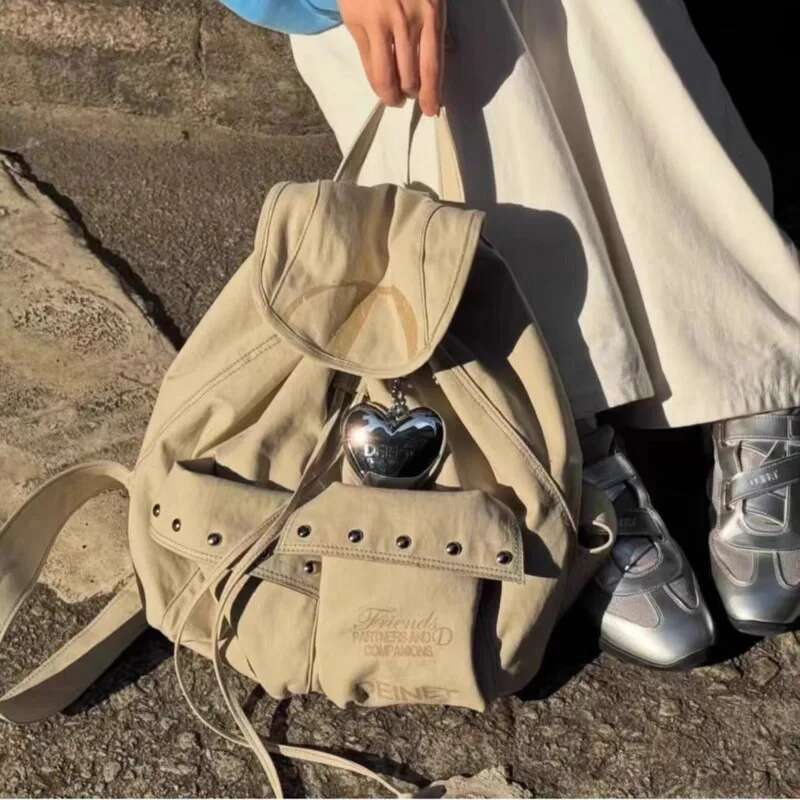 Mochila con cordón de lona con remaches para hombre y mujer, bolso decorativo de gran capacidad, sencillo, informal, Unisex, Y2k, con dos bolsillos