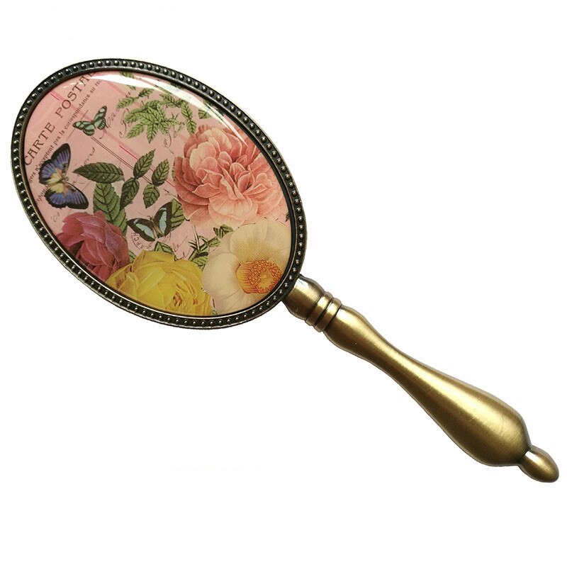 Europeisk vintage antik mässing oval 3 x 4 tum metalllegerad inramad glashandspegel med fjäril epoxidekor bak