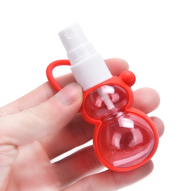 Mini botella portátil de Gel desinfectante de manos, cubierta de viaje extraíble, colores aleatorios, dibujos animados, 30ml, 1 unidad