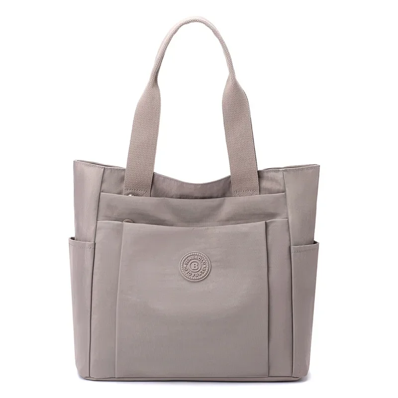 Sac décontracté pour femmes, à la et décontracté, nouvel article 2024, sac mère à main en tissu nylon solide de grande capacité à bandoulière unique