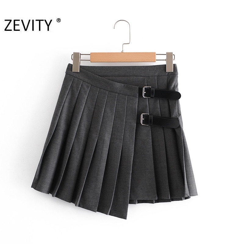 Zevity-Mini jupe plissée pour femme, décoration boucle douce, couleur unie, Style anglais, vêtement Slim et Chic, QUN703, décontracté