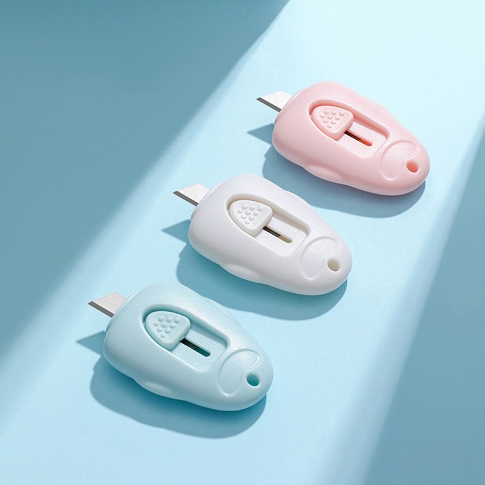 Mini cuchillo utilitario portátil con forma de pata de gato rosa, cortador retráctil, abridor de sobres, herramienta de corte de papel, suministros escolares y de oficina, 1 unidad