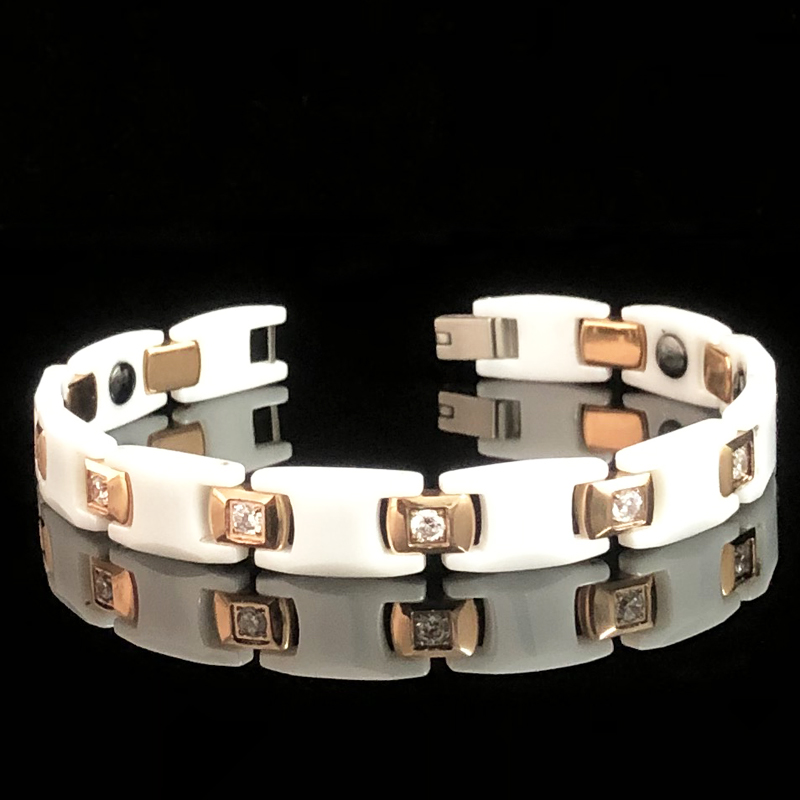 Schönes weißes keramik-paararmband mit magnetverschluss für damen und herren.