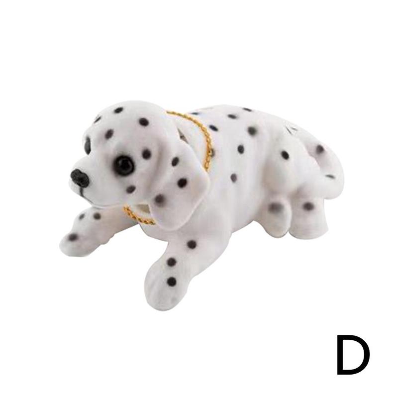 Dukke nikkende hund ryster på hovedet harpiks simulation bil hundelegetøj instrumentbræt dekoration bil ornament sød bil tilbehør: D