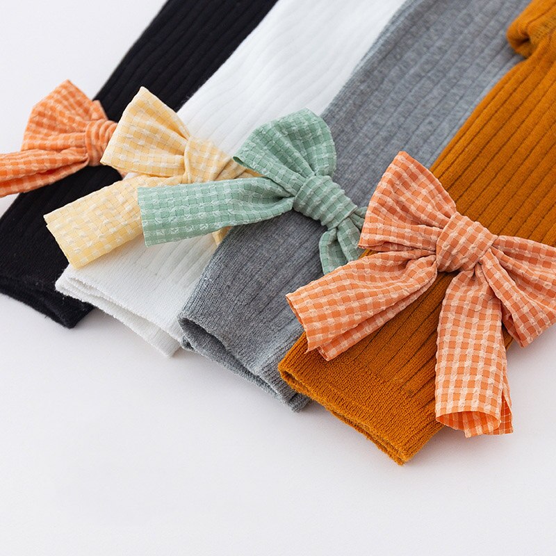 Doce cor sólida bowknot collants do bebê outono inverno quente criança leggings princesa macio respirável criança menina meia-calça