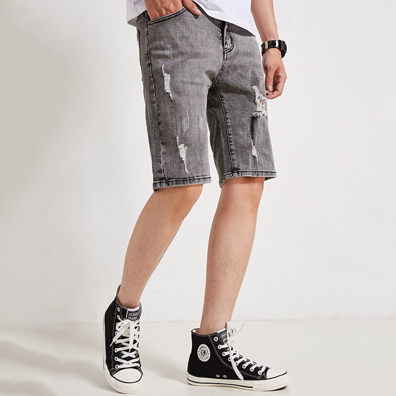 Pantalones cortos de mezclilla para hombre nuevos pantalones cortos de cinco puntos coreanos casuales de tiro medio sueltos elásticos rizados tamaño 28-35 36
