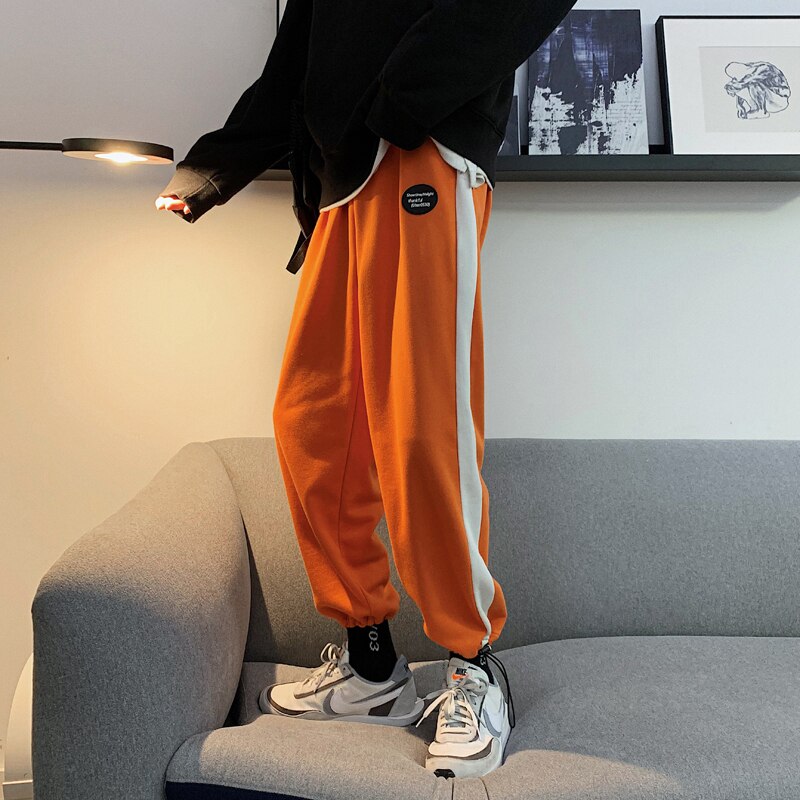 Verkkarit miesten hittivärit rento lenkkeilyhousut miesten katuvaatteet villi löysät hip hop suorat housut miesten verryttelyhousut