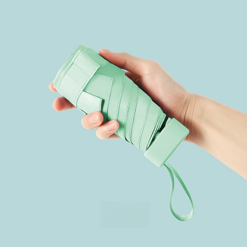 Paraguas de cápsula portátil Mini sombrilla protector solar paraguas de lluvia mango de aleación de caucho negro plegable sol lluvia doble uso cápsula Umb: Verde