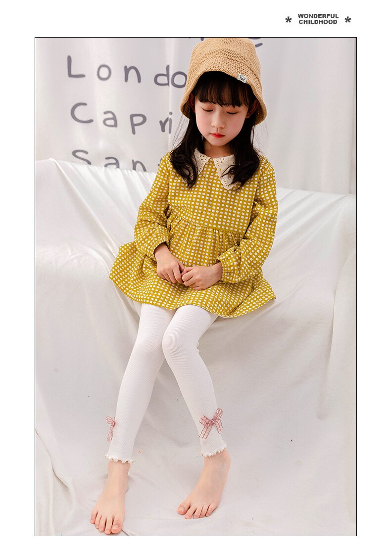 Cute girl hollow bow knot orecchie di legno pantaloni a nove punte primavera e autunno leggings slim per bambini a sezione sottile verticale sottile