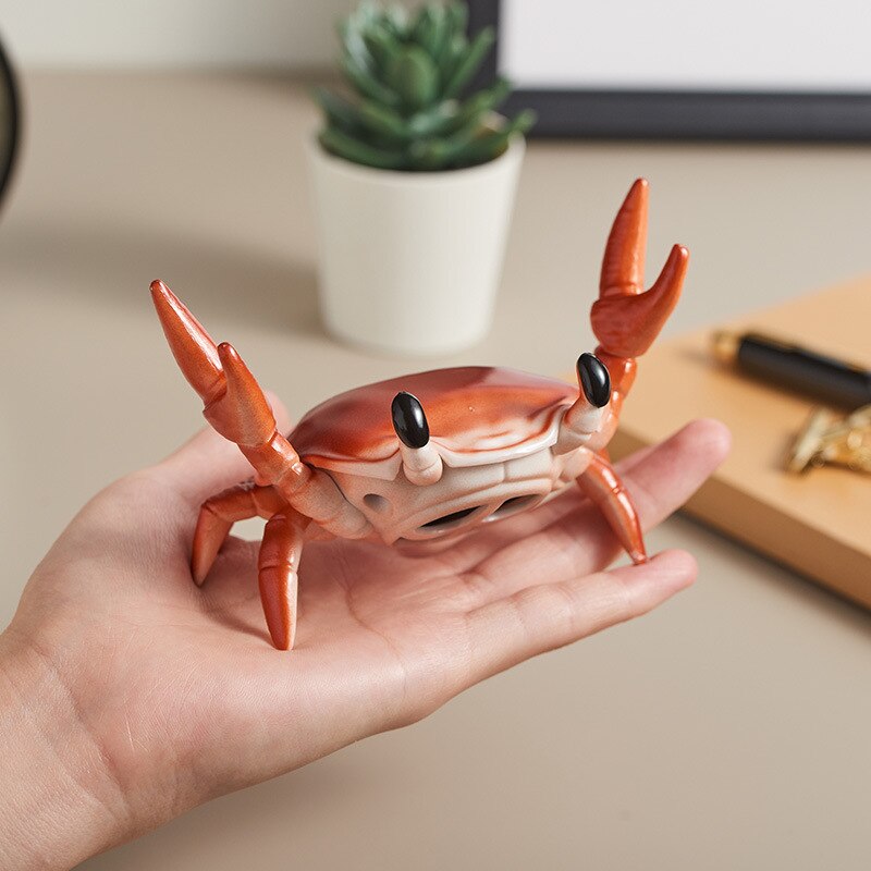 Krabbenförmiger kabelloser bluetooth-mini-lautsprecher mit handyhalterung, tragbarer surround-sound-knopf, audioelektronik