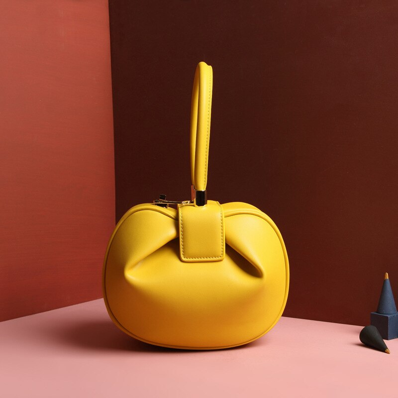 Bag girl leather bag European and American retro niche wonton hand dumpling wonton bag: yellow large