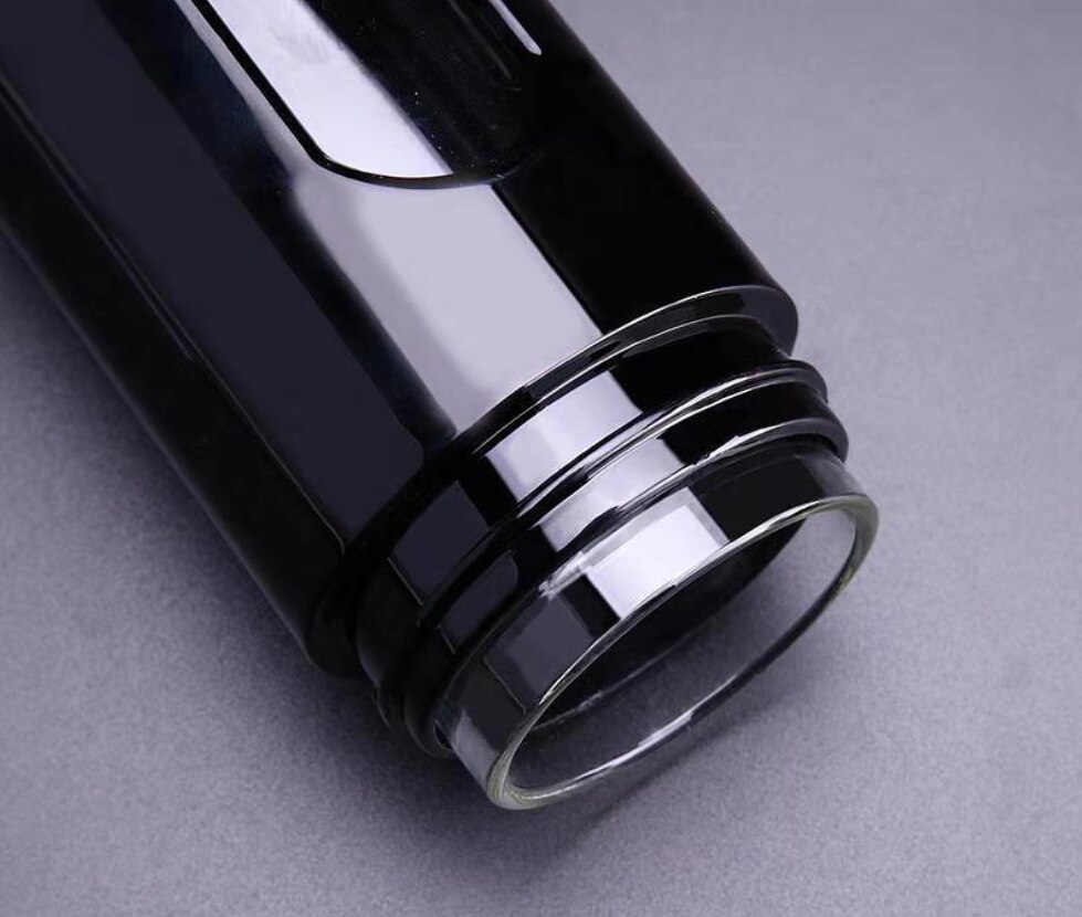 A double‑wall glass water bottle with a silicone sleeve and sleek cap