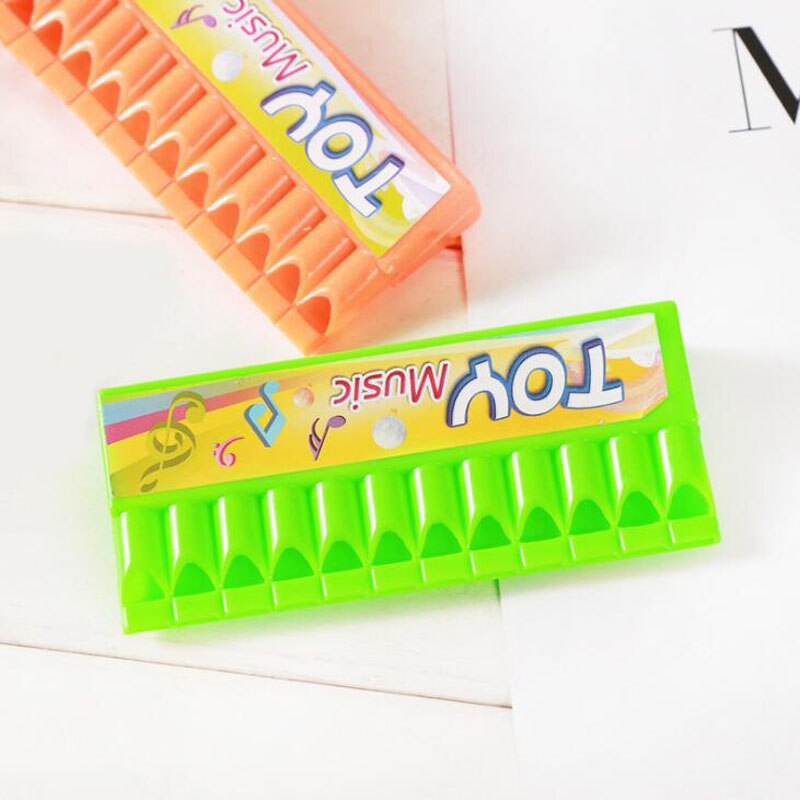 10 stuks / partij kinderen plastic speelgoed mini mondharmonica cartoon mondharmonica spelen klein muziekinstrument speelgoed