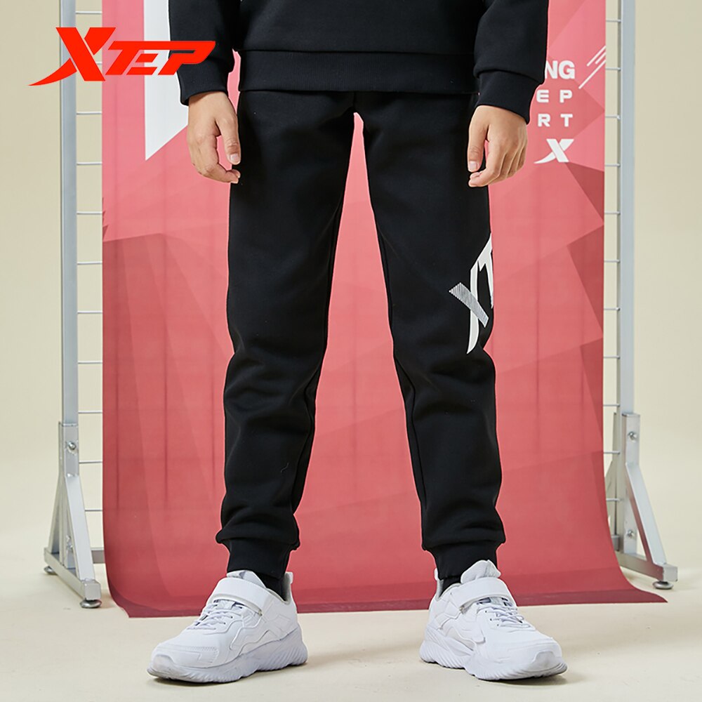 Spodnie dziecięce Xtep 2020 jesienne i zimowe spodnie chłopięce plus kaszmir ciepły tendencja zwykły spodnie sportowe 680426639028