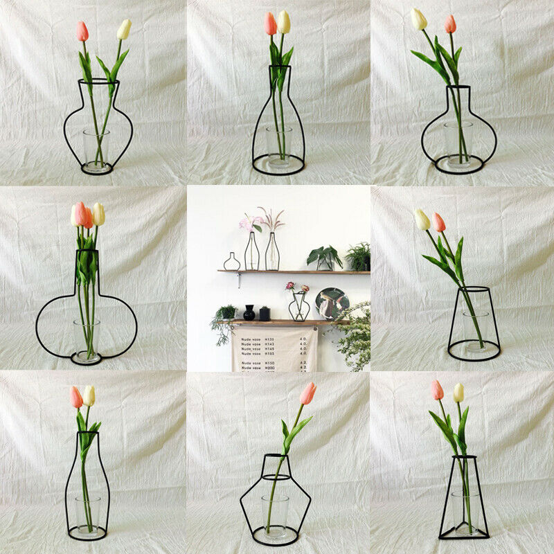 Svart blomstervase grytehengende jernstativ uten glasspynt kontorinnredning