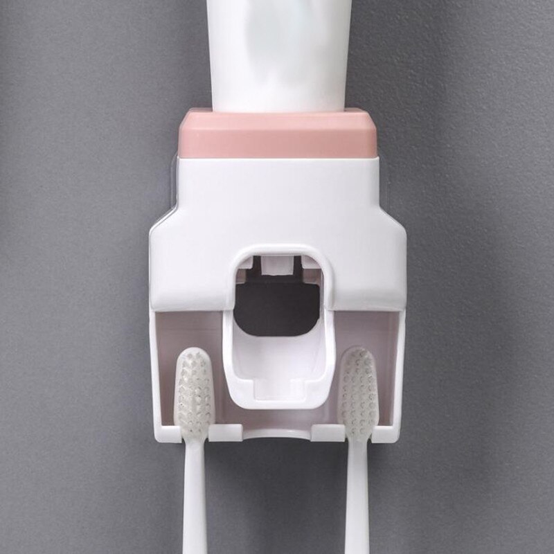 Automatisk tandpasta klemme vægmonteret tandpasta tandbørste holder til husholdningsartikler: Lyserød