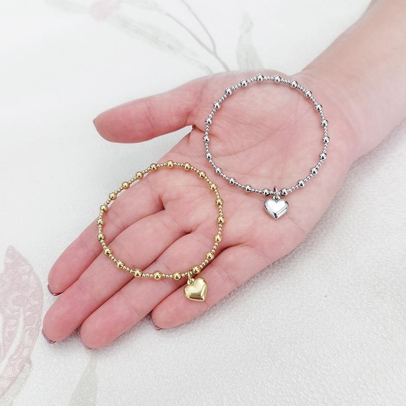 Impermeabile non sbiadisce metallo gioielli in acciaio inossidabile ragazza festa durevole solido perline rotonde braccialetto di elasticità a forma di cuore liscio