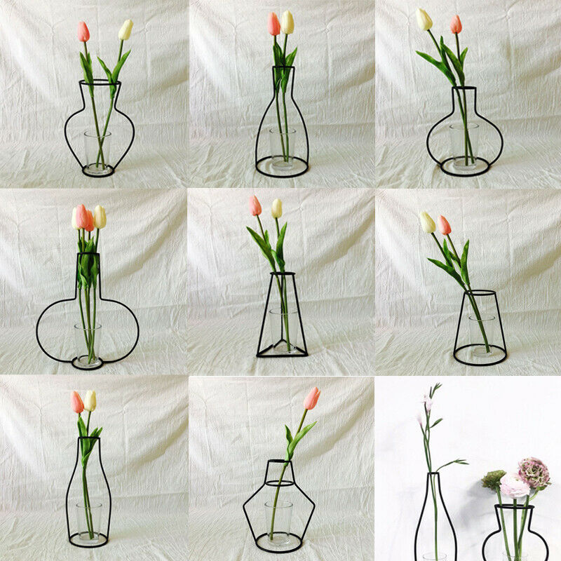Svart blomstervase grytehengende jernstativ uten glasspynt kontorinnredning