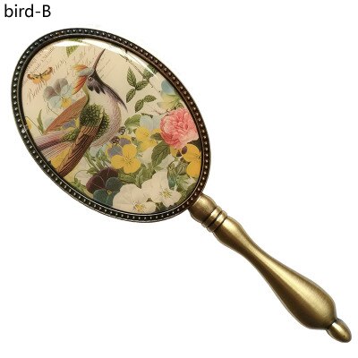 Europeisk vintage antik mässing oval 3 x 4 tum metalllegerad inramad glashandspegel med fjäril epoxidekor bak: Fågel b