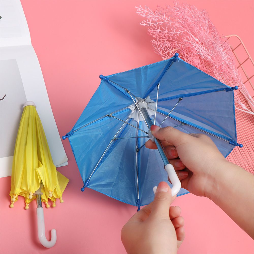Neue Stil Bunte Kunststoff Mini Regenschirm Regen Getriebe Spielzeug Regenschirm Baby Spielzeug Mädchen Puppe Verschönerung Puppe Kleidung Dekoration