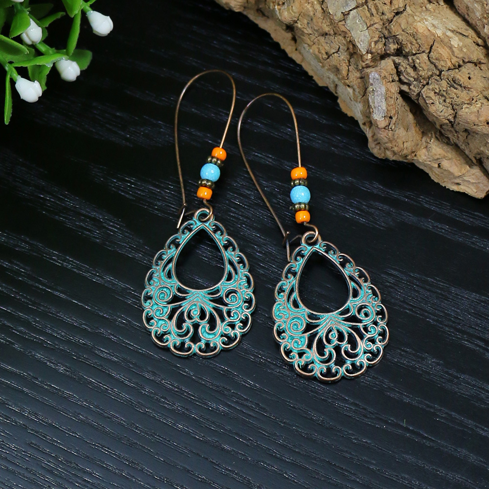 Pendientes bohemios étnicos Vintage de Color bronce para mujer, aretes colgantes geométricos de flor tallada en piedra azul clásica, joyería Jhumka: Deep Purple