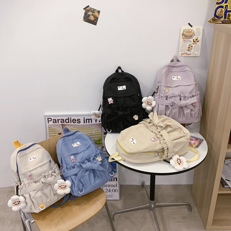 Mochila de estilo coreano para mujer, morral escolar Kawaii de gran capacidad con bolsillos abiertos y lazo, morral de viaje para adolescentes y niñas