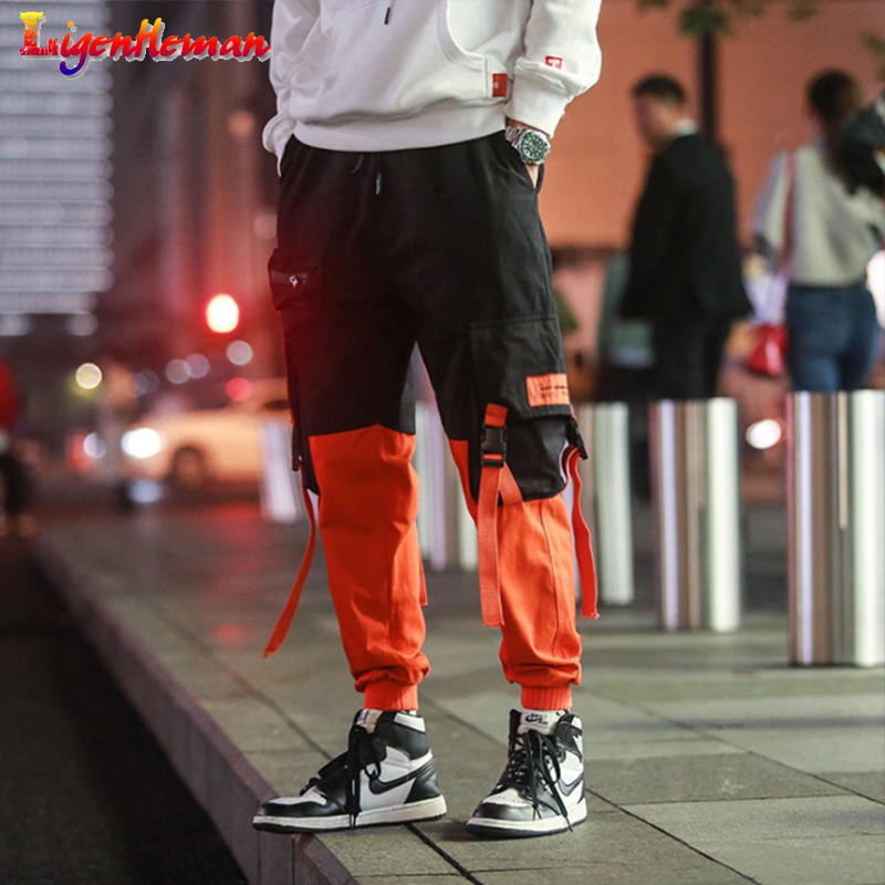 Hombres suelta ropa informal estilo Hip hop coreano pantalones Harem con bolsillo pantalones de tobillo de longitud de remiendo Casual Cargo pantalones de chándal