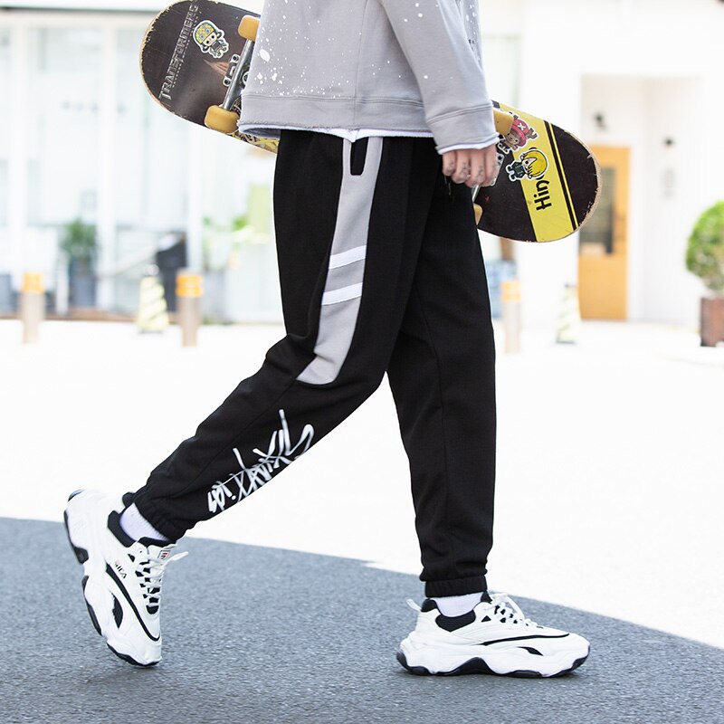 Streetwear løse mænd bukser udendørs sportsbukser ankel bundet mellem talje elastik mandlig hip-hop bogstav efterår lange bukser