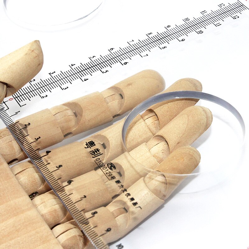 Plastic protractor 180 degrees, 25 cm in diameter, transparent organic material