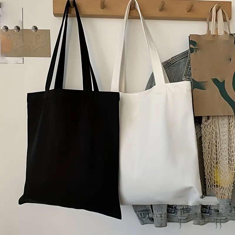 Einfache und lässige einfarbige Segeltuch-Material-Handheld-Umhängetasche für Damen mit großer Kapazität zum Einkaufen und Reisen