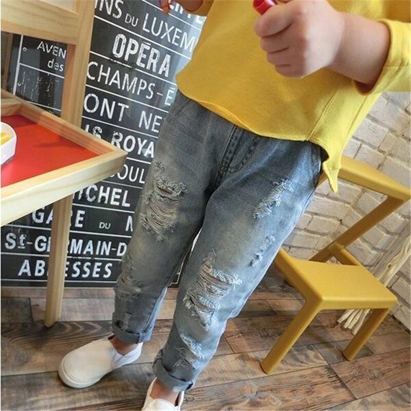Moda bambini Jeans strappati Jeans pantaloni Jeans per ragazze pantaloni in Denim per ragazzi Jeans per bambini pantaloni in Denim rotto per bambini vestiti per bambini