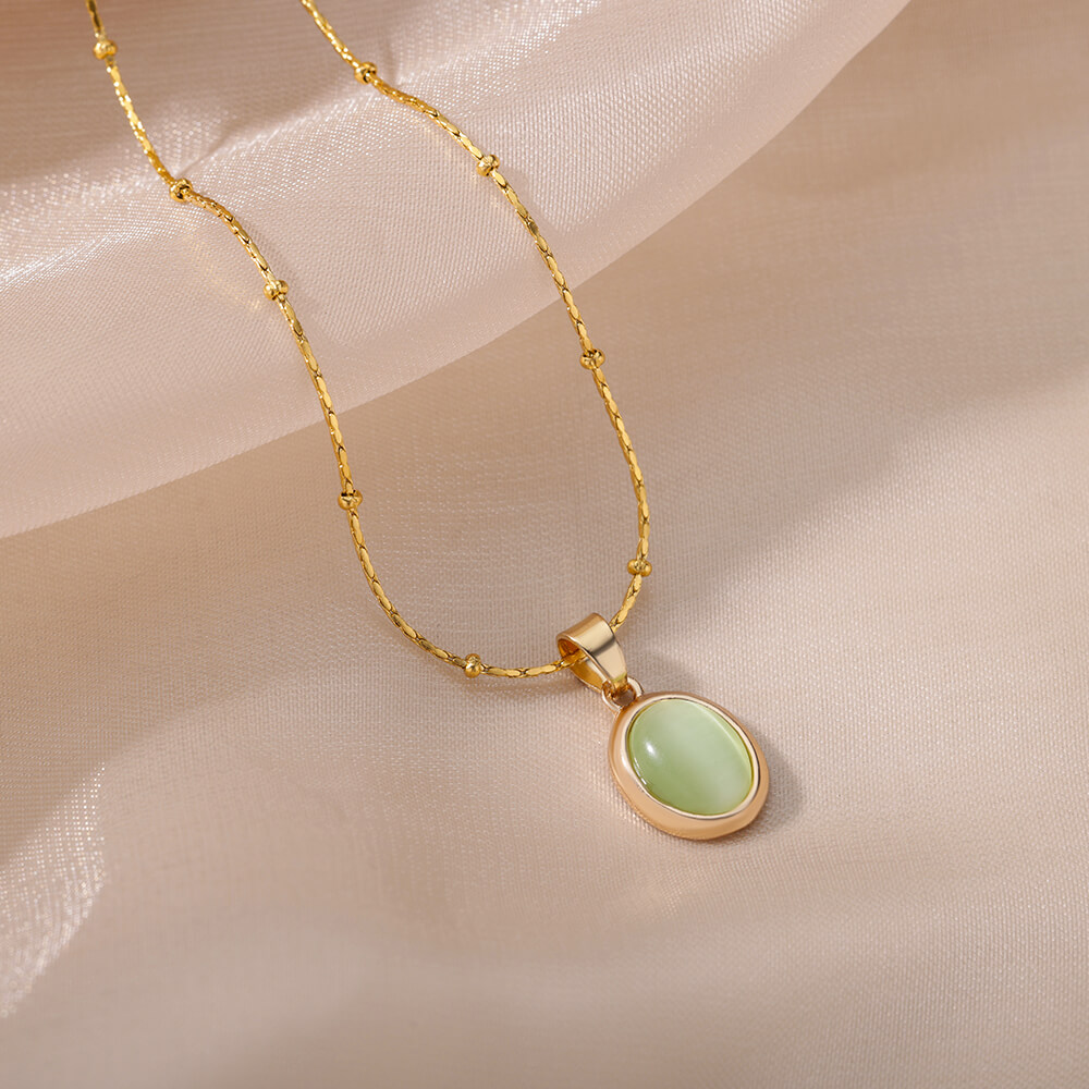 Ovale ketting met opaalsteen voor dames, gemaakt van roestvrij staal met een gouden ovale stenen hanger, ideaal voor een bruiloft.