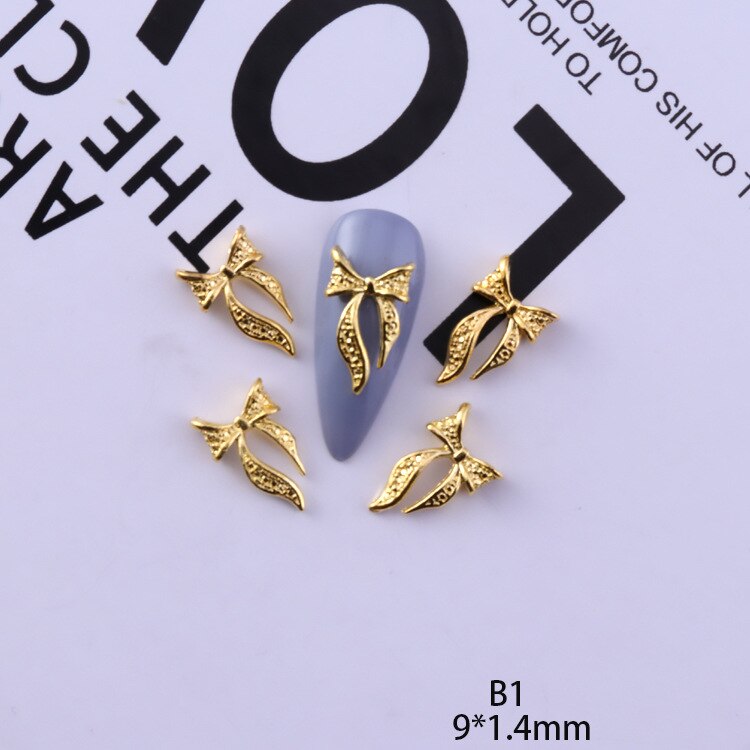 50 pezzi di ciondoli in lega d'oro e d'argento per unghie papillon farfalla 3D multi-forme accessori per unghie per ciondoli gioielli per chiodo arte giapponesi: bianca