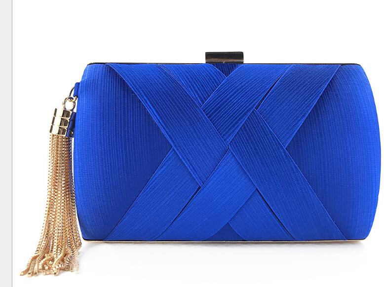 Hand holding dinner bag satin fringed dress bridal evening bag