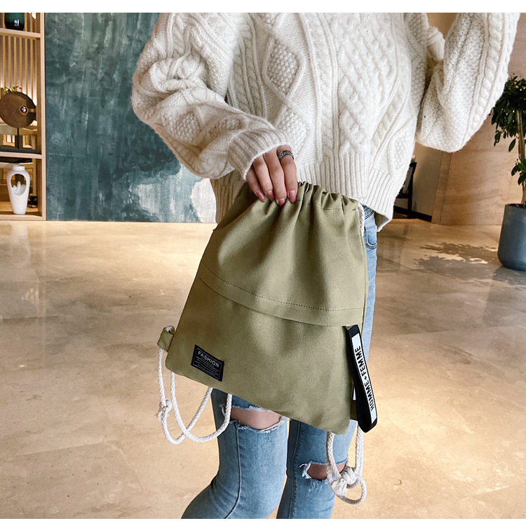 2022 neue Frauen lässig Leinwand Rucksack Männer Einfarbig knapp aufbringen Tasche Zeichnung Riemen Verschluss draussen Tasche