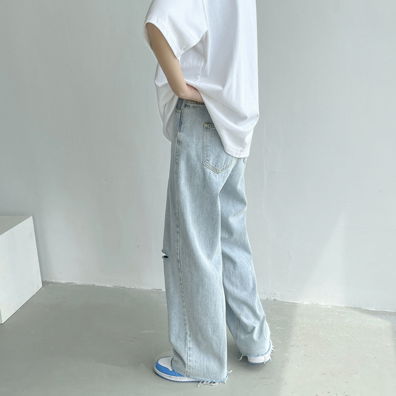 Letnie jeansy szerokie nogawki męskie modne oświetlenie niebieskie dorywczo porwane jeansy męskie Streetwear luźne spodnie biodro-hopowe proste spodnie jeansowe męskie