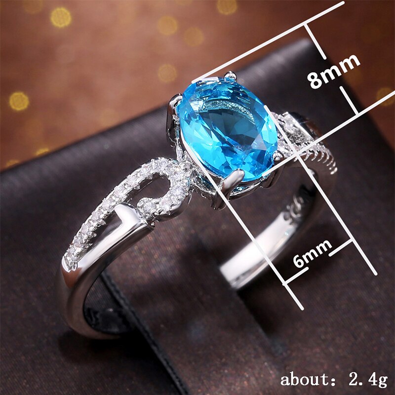 Huitan-anillo de compromiso clásico con piedras ovaladas para mujer, joyería de lujo con Micro incrustaciones de nubes, color azul cielo, CZ