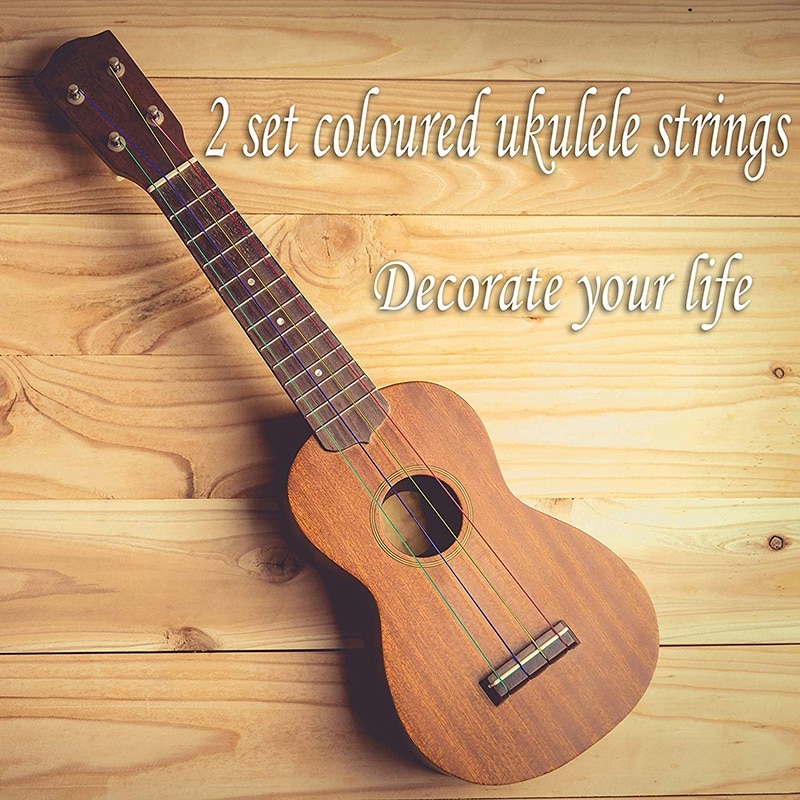 Ukuleletillbehörssats med ukulelefiltplockar celluloidplockar läderplockhållare flerfärgade snören och vita nylonsnören