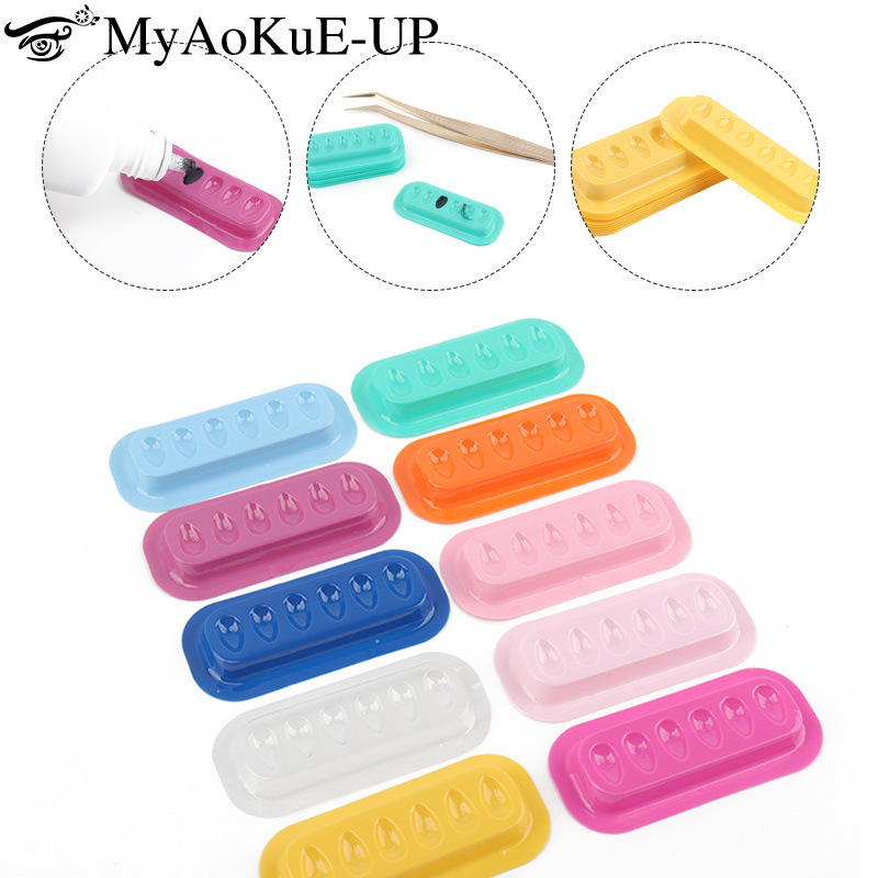 100 pièces porte-colle à cils Palette Extension de cils support adhésif tampons bande en forme de joint en plastique Palette cils artiste accessoires