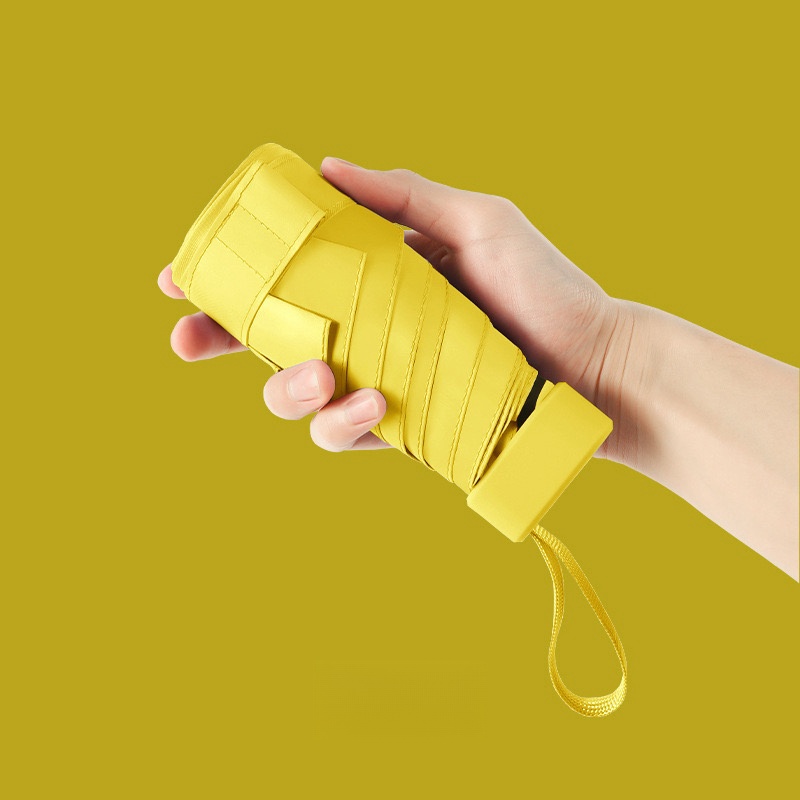 Paraguas de cápsula portátil Mini sombrilla protector solar paraguas de lluvia mango de aleación de caucho negro plegable sol lluvia doble uso cápsula Umb: YELLOW