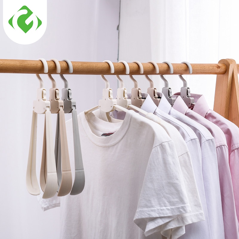 Perchas creativas plegables para almacenaje de ropa y guardarropa organizador de guardarropa percha gruesa de plástico con un botón para encogimiento de ropa