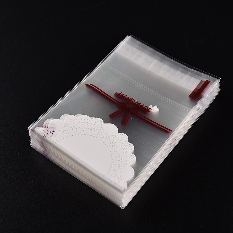 100 stks Mooie kant boog Print Zakken Kerst verpakking zelfklevende plastic zakken Snoep Cake pakket Briefpapier Houder