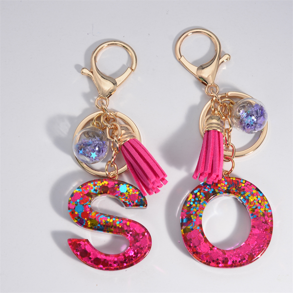 Portachiavi con lettera in paillettes viola lucido in resina 26 iniziali