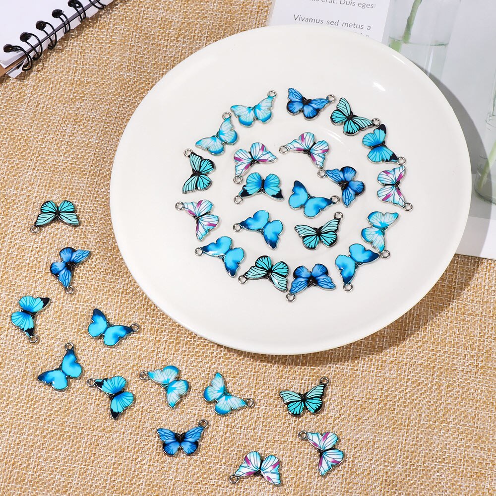 Colgantes de mariposa de esmalte azul, accesorios de joyería hechos a mano, 10 piezas