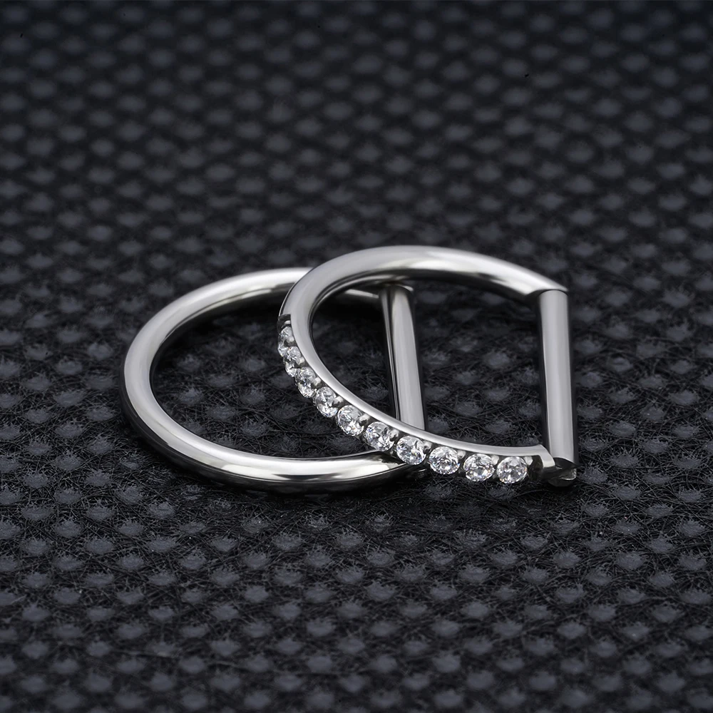 Astm f -136 titanium neusring, daith oorbel, hartvormige oorring, hoepel, kraakbeenring, tragusring, d-vormige helixring, scharnierende segmentring met heldere zirkonia.
